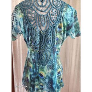 F74 B.L.E.U. beautiful peacock blouse with crochet back